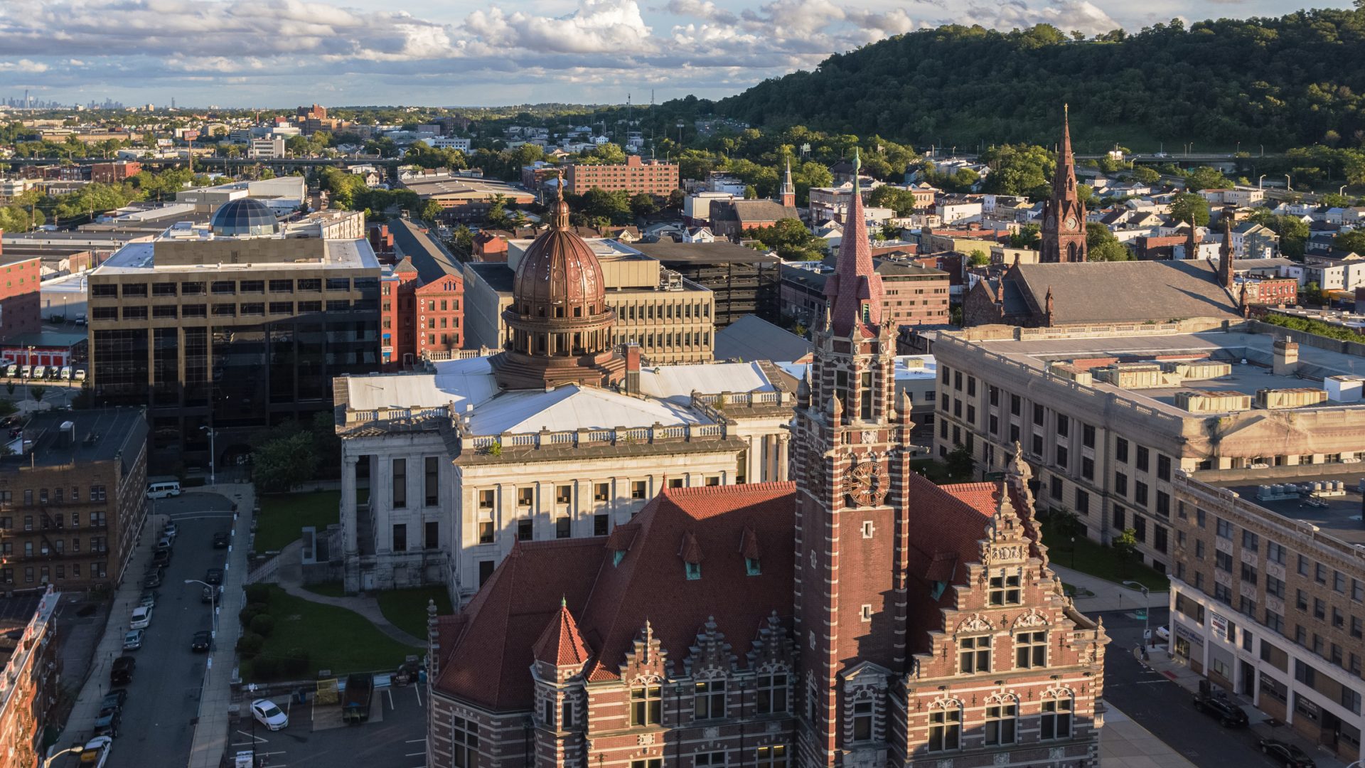 Image of a New Jersey State (Passaic) court house annex representing where you will not have to go if you want to obtain your New Jersey criminal record search online with Triton.